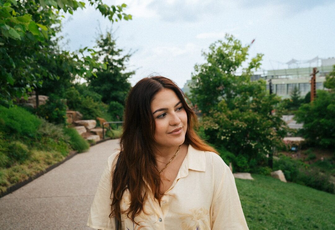 actor smiling in park