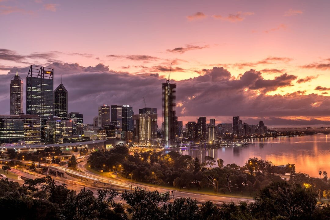 City skyline at dusk with lit buildings